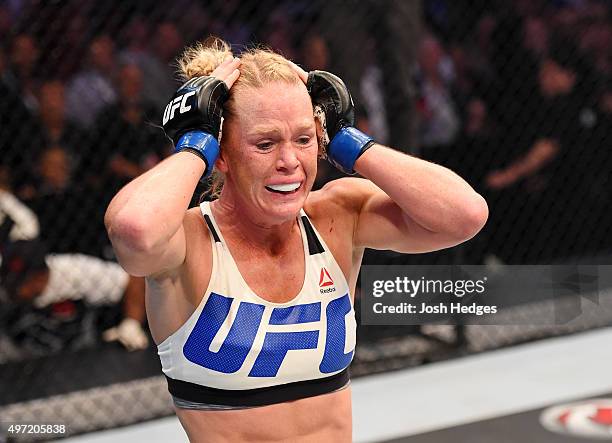 Holly Holm celebrates her second round KO over Ronda Rousey in their UFC women's bantamweight championship bout during the UFC 193 event at Etihad...