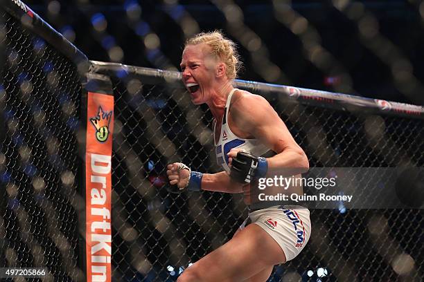 Holly Holm of the United States celebrates victory over Ronda Rousey of the United States in their UFC women's bantamweight championship bout during...