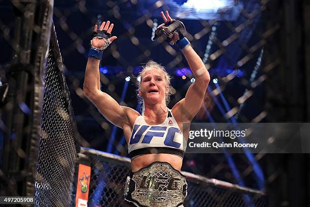 Holly Holm of the United States celebrates victory over Ronda Rousey of the United States in their UFC women's bantamweight championship bout during...