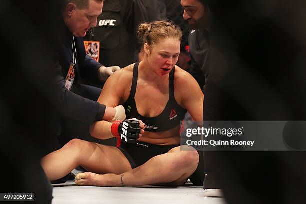 Ronda Rousey of the United States receives medical treatment after being defeated by Holly Holm of the United States in their UFC women's...