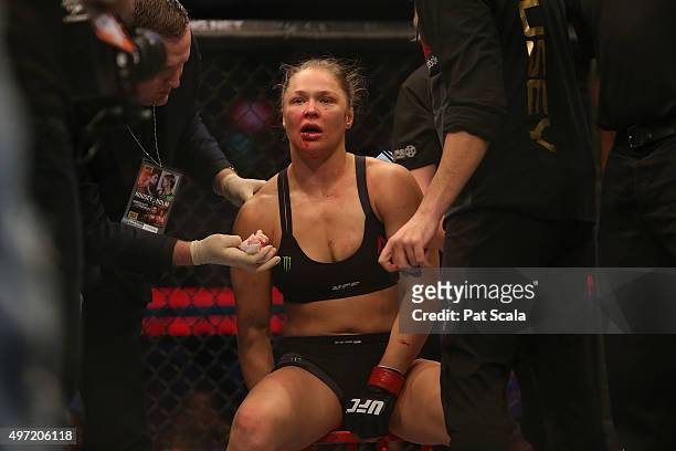 Ronda Rousey of the United States receives medical treatment after being defeated by Holly Holm of the United States in their UFC women's...