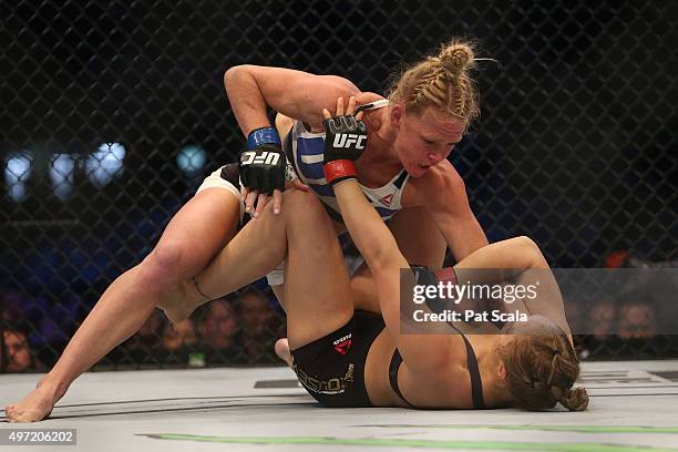 Ronda Rousey of the United States and Holly Holm of the United States compete in their UFC women's bantamweight championship bout during the UFC 193...