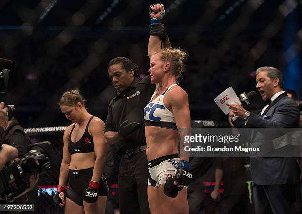 New UFC women's bantamweight champion Holly Holm of the United States celebrates her victory over Ronda Rousey of the United States during the UFC...