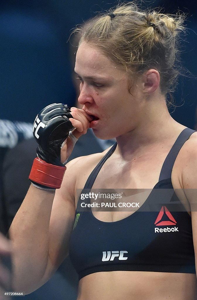 Ronda Rousey Box Ronda Rousey of the US holds he lip after being knocked out by... News ...