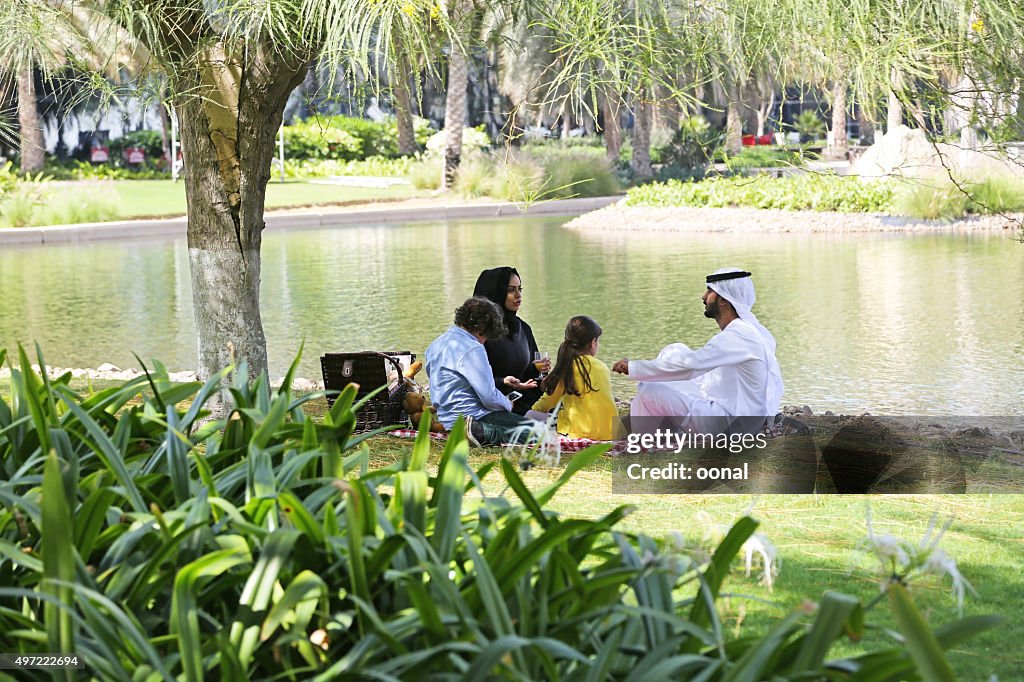 Arab family enjoying their leisure time in picnic