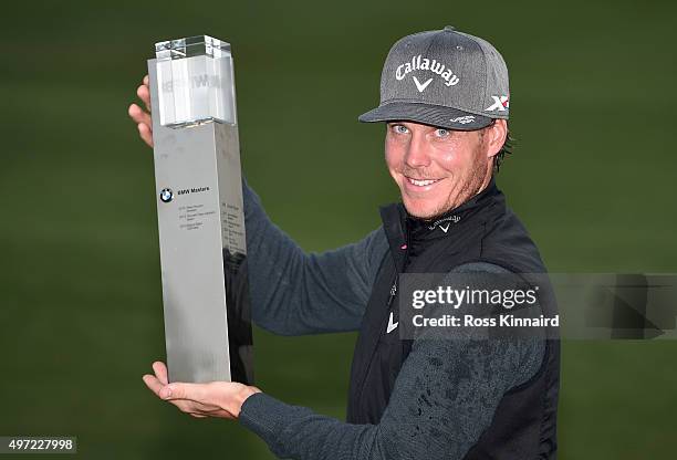 Kristoffer Broberg of Sweden with the winners trophy after the final round of the BMW Masters at Lake Malaren Golf Club on November 15, 2015 in...