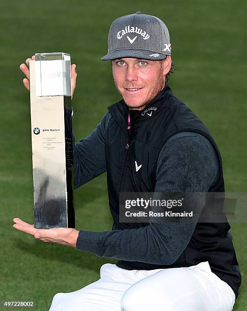 Kristoffer Broberg of Sweden with the winners trophy after the final round of the BMW Masters at Lake Malaren Golf Club on November 15, 2015 in...