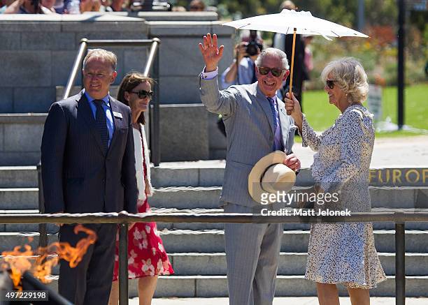 Prince Charles, Prince of Wales and Camilla, Duchess of Cornwall wave at the Flame of Remembrance while on a walk through Kings Park on November 15,...