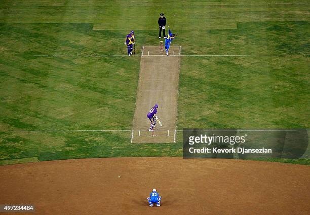Sachin's Blasters bowler Curtly Ambrose delivers a ball against Warne's Warriors batsman Andrew Symonds during the final game of three-match three...