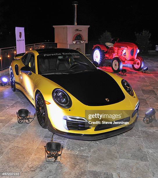 Porsche vehicles are displayed at the GRAMMY Foundation house concert featuring The Band Perry at Trattore Farms on November 14, 2015 in Geyserville,...