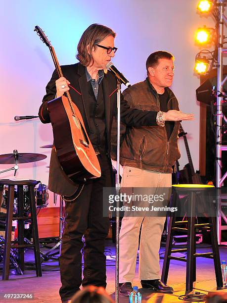 Scott Goldman, VP of the GRAMMY Foundation and MusiCares and Tim Bucher, President of Trattore Farms auction off items at the GRAMMY Foundation house...