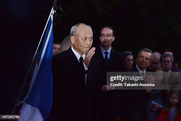 Governor of Tokyo, Yoichi Masuzoe reacts after his speach at the French embassy on November 15, 2015 in Tokyo, Japan. At least 128 people were killed...