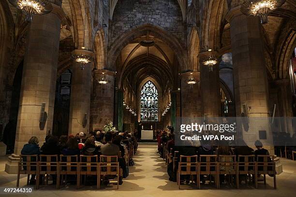 People look on during a special service in solidarity with the people of Paris after Friday's terrorist attacks at St Giles Cathedral on November 15...