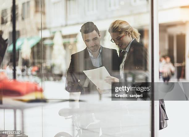 businessman with his colleague communicating - partnership men bikes stockfoto's en -beelden