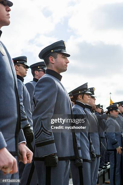 west point cadets at attention during national anthem. - west point military academy stock pictures, royalty-free photos & images