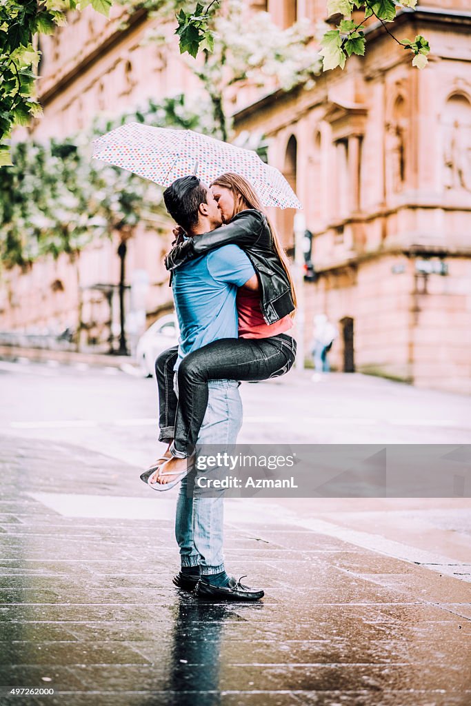 Kissing under Umbrella