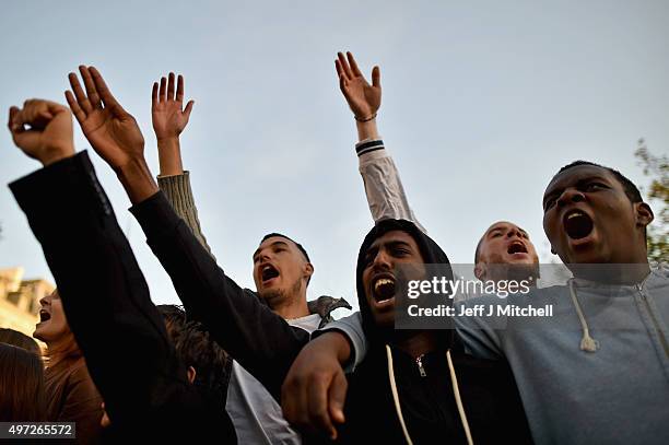 People sing the French national anthem at Place de la Republique as France observes three days of national mourning for the victims of the terror...