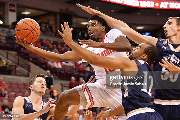 JaQuan Lyle of the Ohio State Buckeyes is fouled by Taylor Danaher of the Mount St. Mary's Mountaineers as he drives to the basket in the first half...