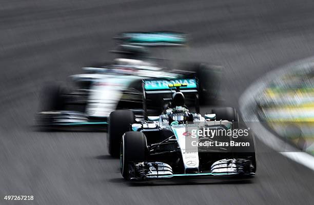 Nico Rosberg of Germany and Mercedes GP drives infront of Lewis Hamilton of Great Britain and Mercedes GP during the Formula One Grand Prix of Brazil...