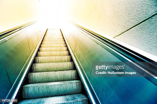 pedestrian escalator - yellow light stock pictures, royalty-free photos & images