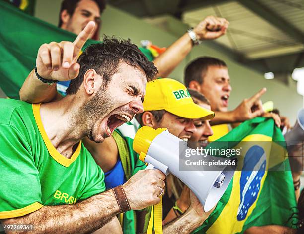 sport supporters: fans of the brazilian team - fan expo stock pictures, royalty-free photos & images
