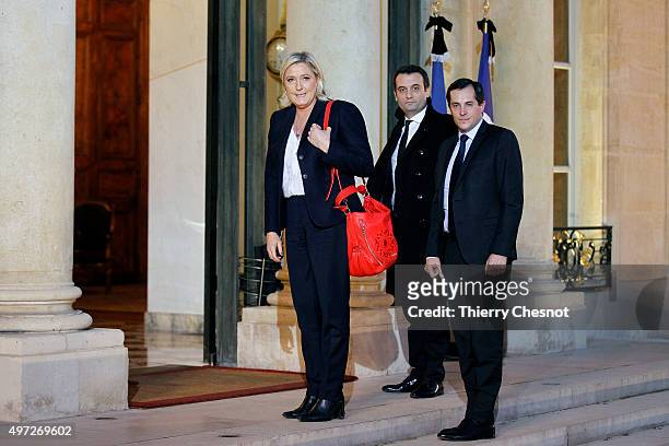 French leader of the French Far-right party Front National Marine Le Pen flanked by FN vice-president Florian Philippot and FN secretary general...