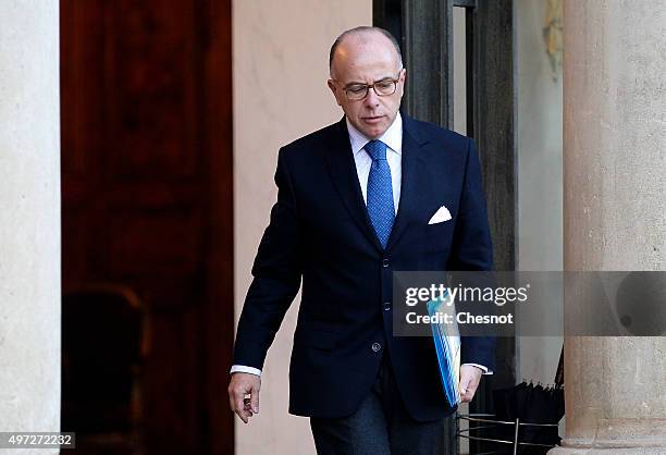 French Minister of the Interior Bernard Cazeneuve leaves after a meeting with the French President at the Elysee Presidential Palace on November 15,...