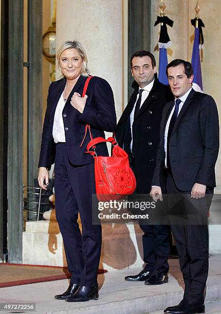 French leader of the French Far-right party Front National Marine Le Pen flanked by FN vice-president Florian Philippot and FN secretary general...