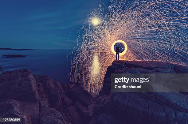 slinging the sparks - long exposure water stock pictures, royalty-free photos & images