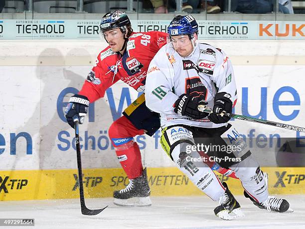 Julian Talbot of the Eisbaeren Berlin and Drew LeBlanc of the Augsburger Panther during the game between the Augsburger Panthern and the Eisbaeren...