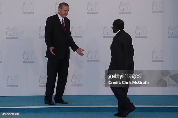 Invited guest, President of Zimbabwe Robert Mugabe is greeted by Turkish President Recep Tayyip Erdogan, during the official welcome ceremony on day...