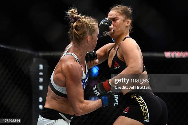 Holly Holm punches Ronda Rousey in their UFC women's bantamweight championship bout during the UFC 193 event at Etihad Stadium on November 15, 2015...