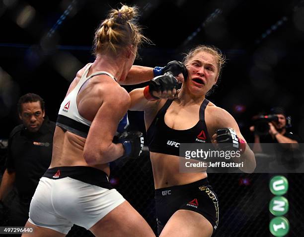 Holly Holm punches Ronda Rousey in their UFC women's bantamweight championship bout during the UFC 193 event at Etihad Stadium on November 15, 2015...