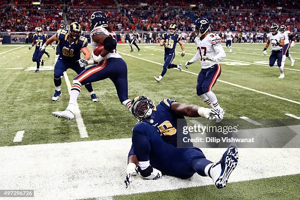 Jamon Brown of the St. Louis Rams injures his ankle while making a play in the fourth quarter against the Chicago Bears at the Edward Jones Dome on...