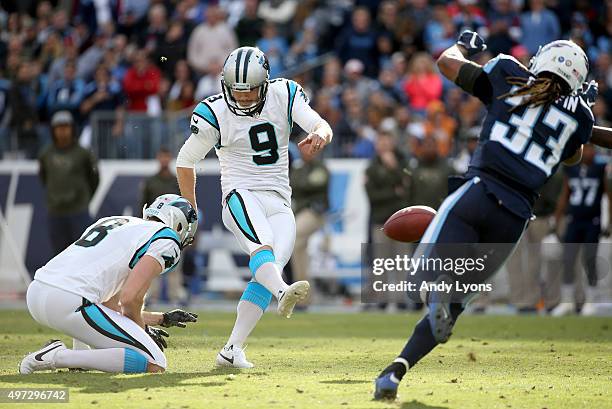 Graham Gano of the Carolina Panthers attempts a kick as Brad Nortman of the Carolina Panthers holds during the second half against the Tennessee...