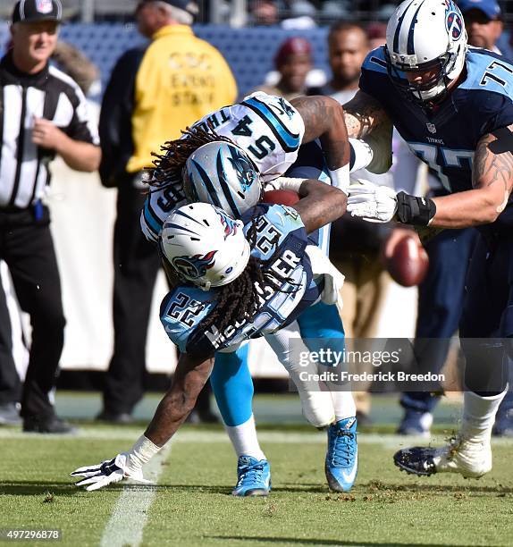 Shaq Thompson of the Carolina Panthers up-ends running back Dexter McCluster of the Tennessee Titans at Nissan Stadium on November 15, 2015 in...