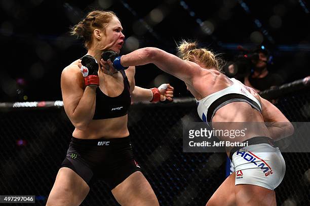 Holly Holm punches Ronda Rousey in their UFC women's bantamweight championship bout during the UFC 193 event at Etihad Stadium on November 15, 2015...