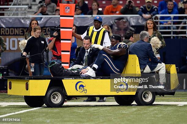 Jamon Brown of the St. Louis Rams is carted off the field after injuring his ankle in the fourth quarter against the Chicago Bears at the Edward...