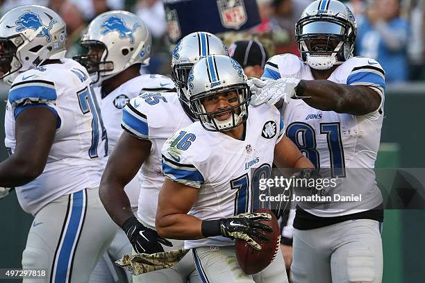 Lance Moore of the Detroit Lions celebrates after scoring the game winning touchdown against the Green Bay Packers in the fourth quarter at Lambeau...