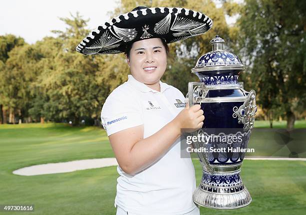 Inbee Park of South Korea poses with the trophy after her three-stroke victory at the Lorena Ochoa Invitational Presented By Banamex at the Club de...