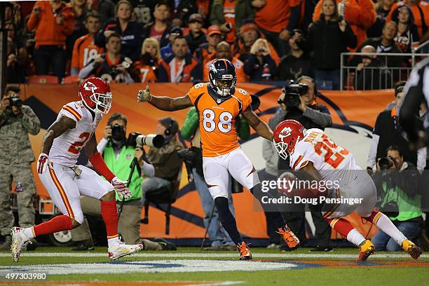 Eric Berry of the Kansas City Chiefs intercepts a pass in the endzone from quarterback Brock Osweiler of the Denver Broncos intended for Demaryius...