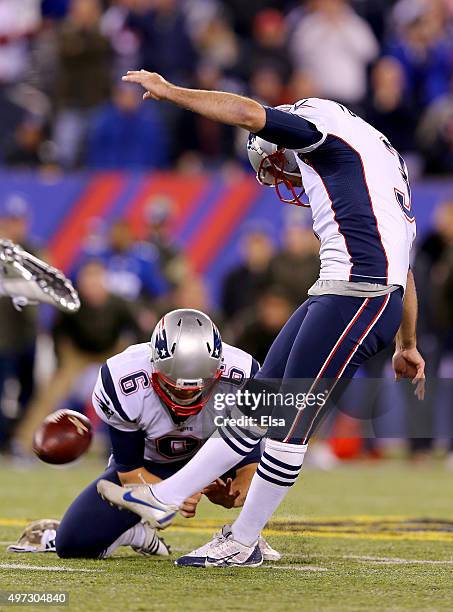 Stephen Gostkowski of the New England Patriots kicks the game winning field goal in the final minute of the game as Ryan Allen holds to give them the...