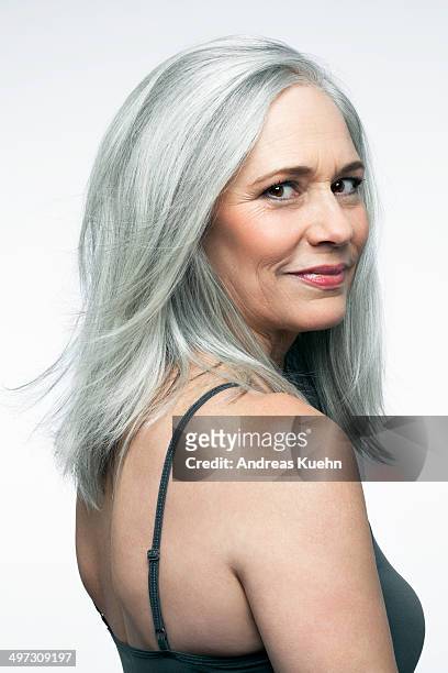 mature woman with grey hair in a 3/4 position. - capelli grigi foto e immagini stock