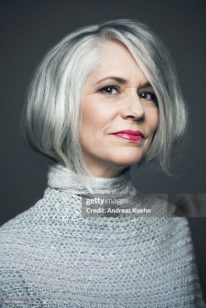 Grey haired lady with red lipstick, portrait.