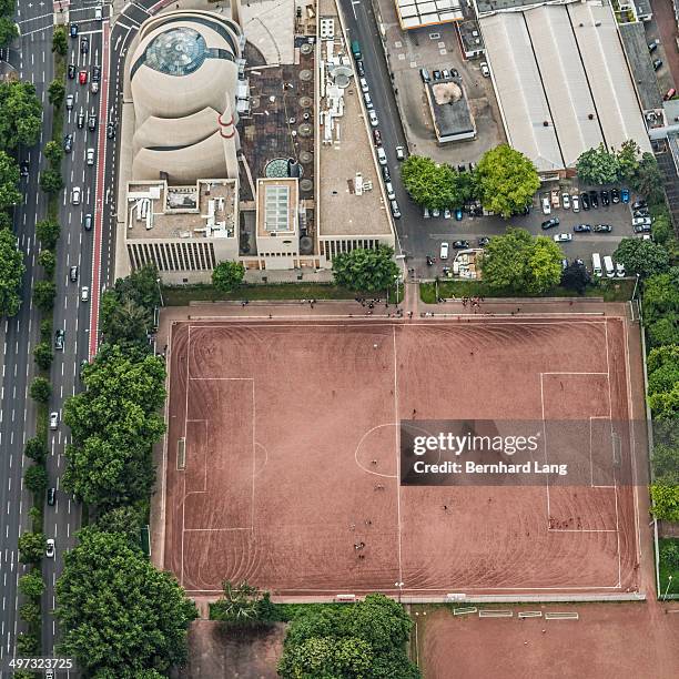 aerial view of soccer field next to mosque - urban football pitch stock pictures, royalty-free photos & images