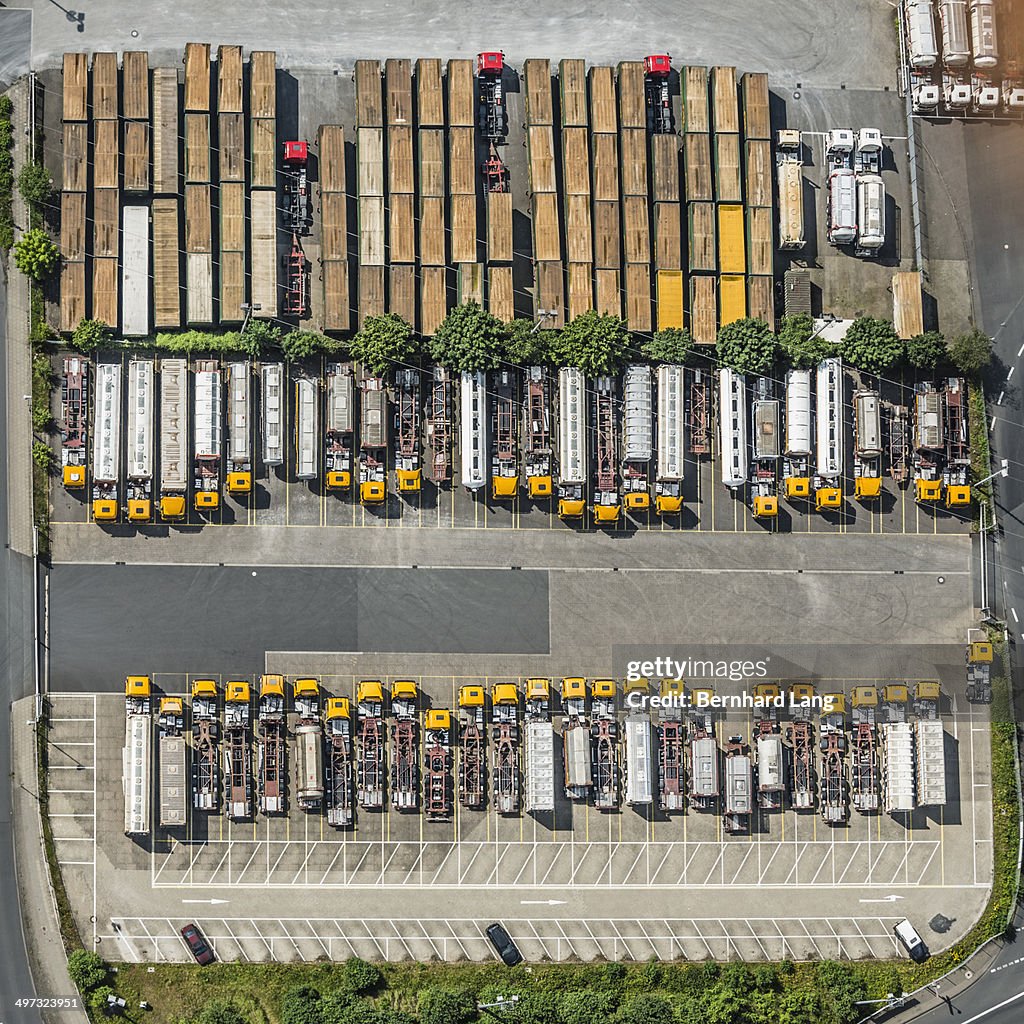 Aerial view of yellow trucks and truck trailers