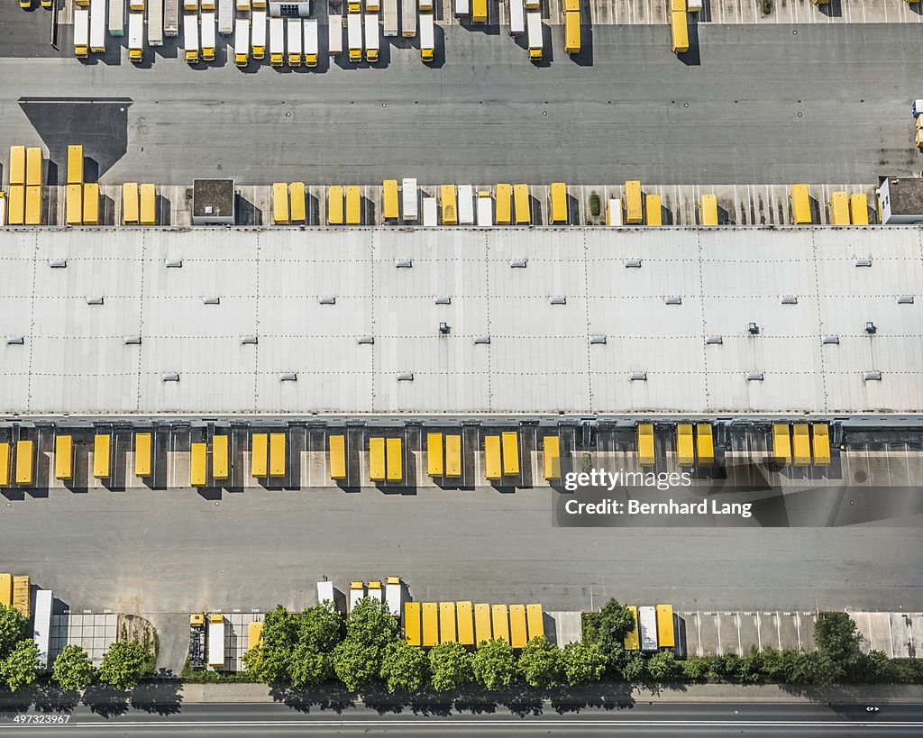 Aerial view of postal trucks and truck trailers