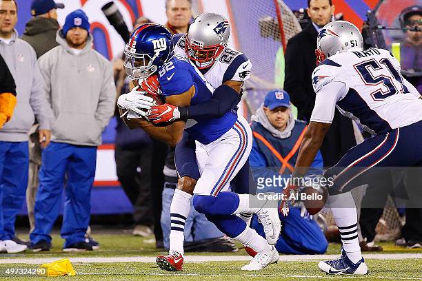 Flag is thrown as Rueben Randle of the New York Giants is tackled by Logan Ryan of the New England Patriots during the fourth quarter at MetLife...