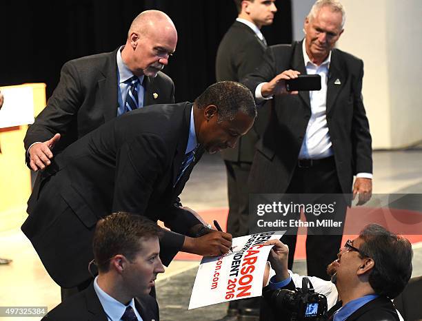 Republican presidential candidate Ben Carson signs autographs after speaking at a campaign rally at the Henderson Pavilion on November 15, 2015 in...