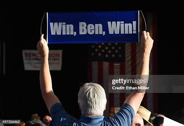 Supporter of Republican presidential candidate Ben Carson holds up a sign as he waits to hear him speak at a campaign rally at the Henderson Pavilion...